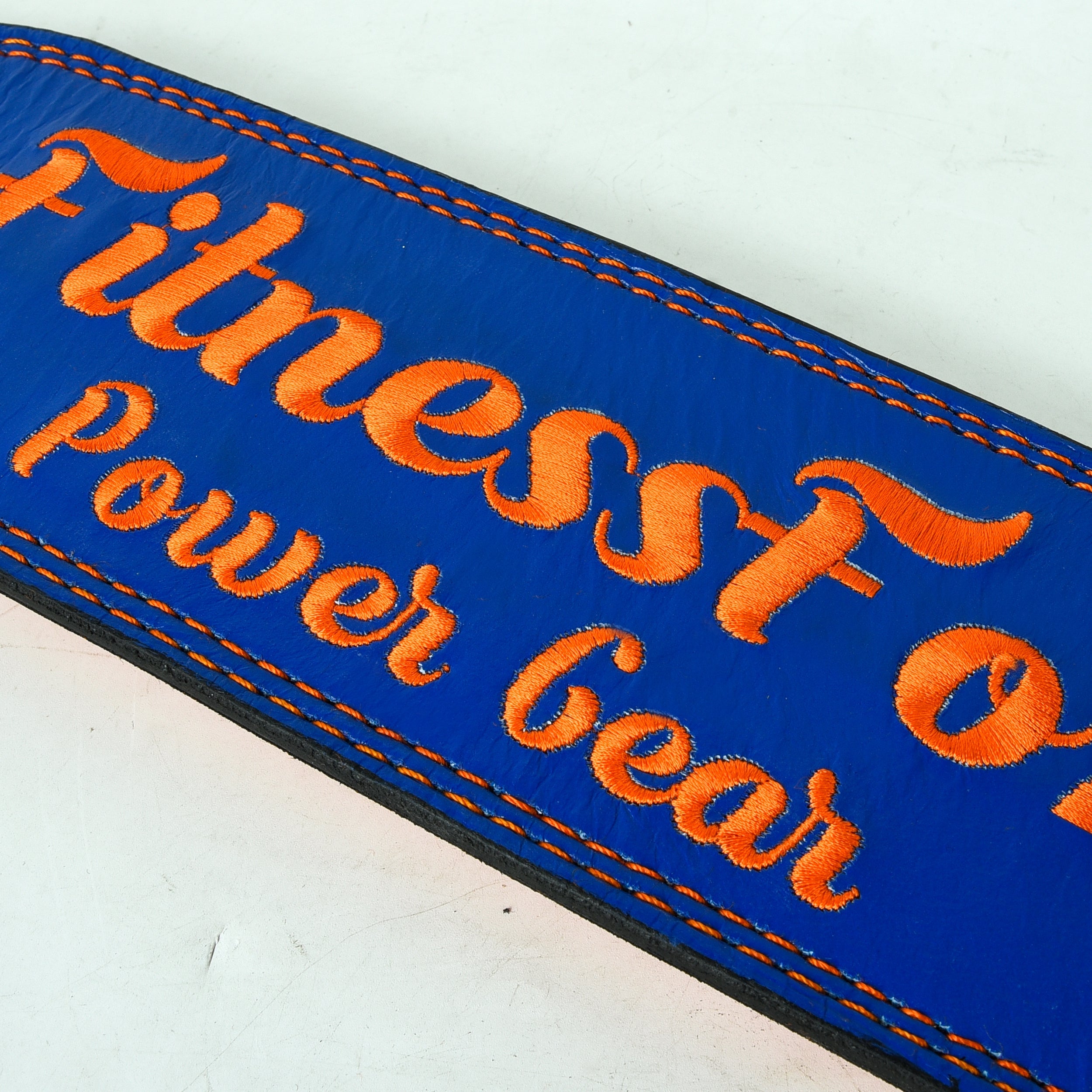 4-inch blue lifting belt by Fitness Fox showing thickness and firm core support