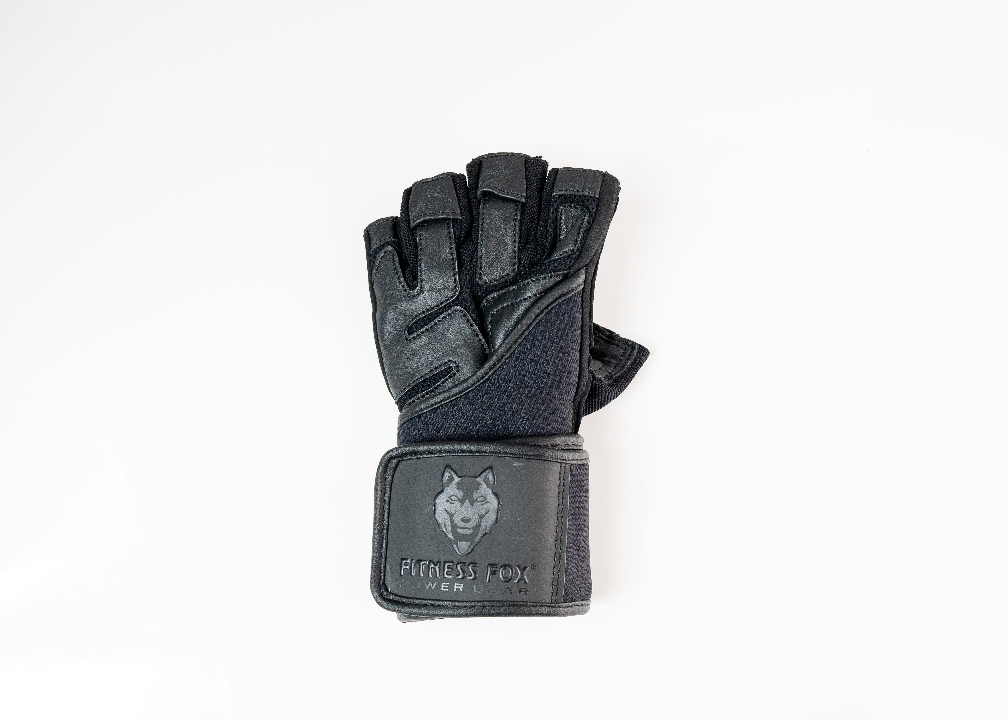 “Angled side profile of black leather gym gloves highlighting breathable polyester back panel and adjustable wrist strap for customized tightness during training.”