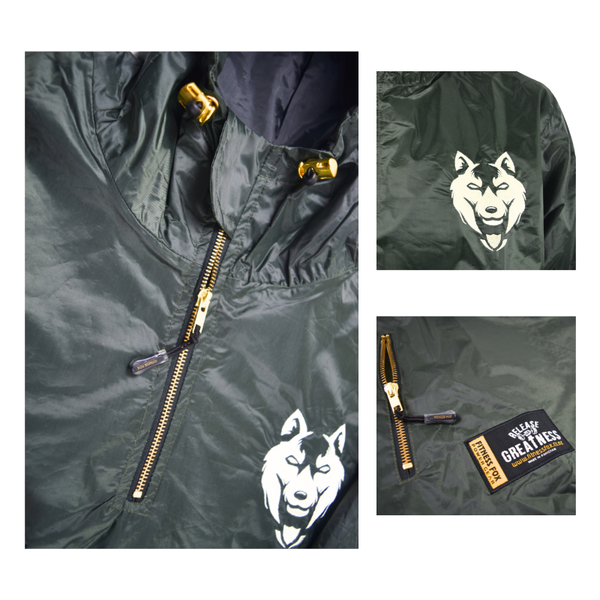 “Close-up of embroidered gold Fitness Fox logo on forest green sauna jacket, double-layer construction subtly visible.”