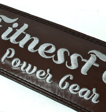 4-inch maroon lifting belt by Fitness Fox showing thickness and firm core support