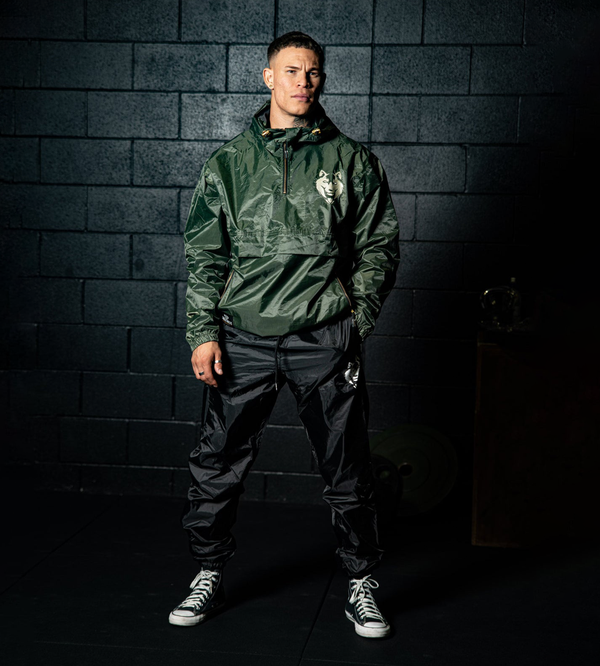 Forest green Fitness Fox hooded half-zip sauna jacket shown front-on, double-layer shell and embroidered gold logo visible.